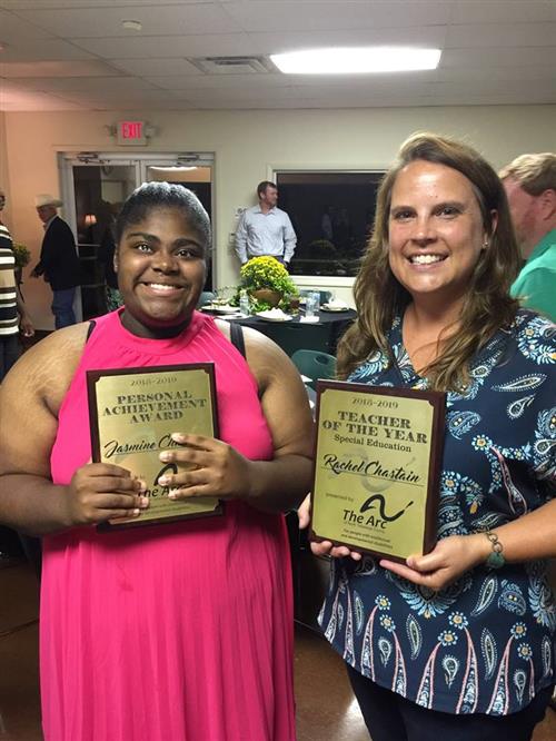  Jazmine and Ms. Rachel pose holding their awards.